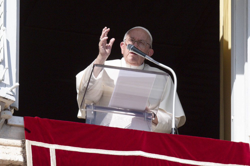 Pope Francis leads the recitation of the Angelus from a window of the Apostolic Palace at the Vatican Nov. 1, 2022, the feast of All Saints.