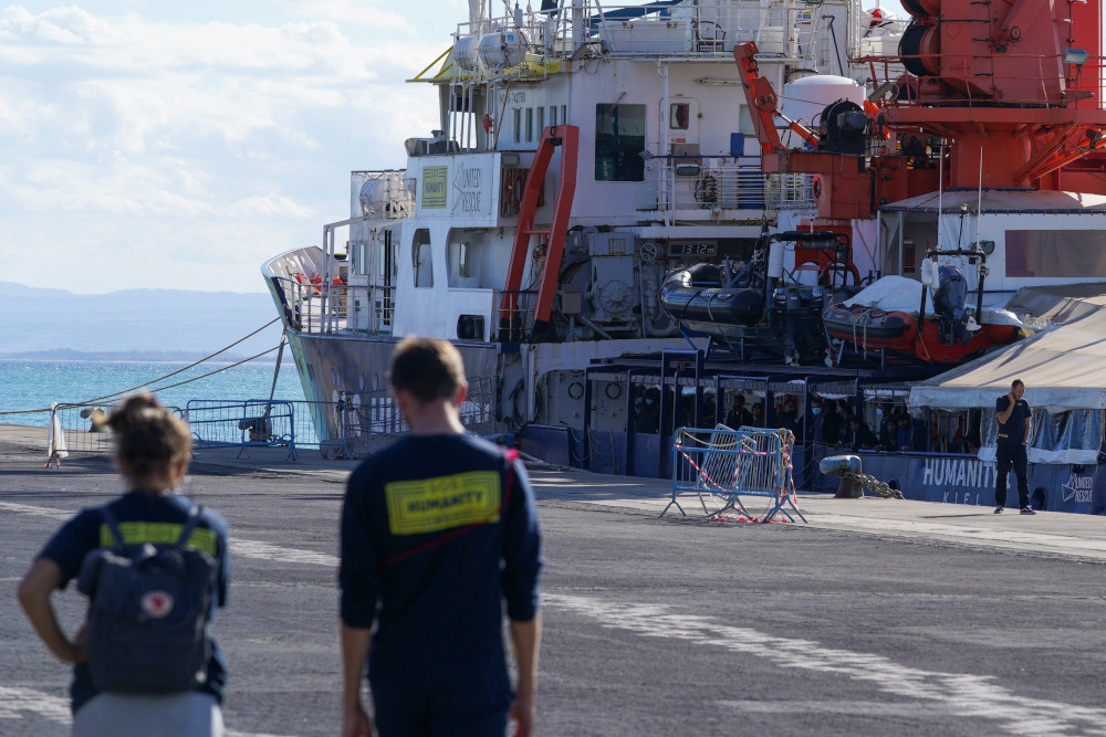 People stand onboard the NGO rescue ship Humanity 1 after Italy allowed the disembarkation of children and sick asylum-seekers in Catania, Italy, Nov. 7, 2022. 