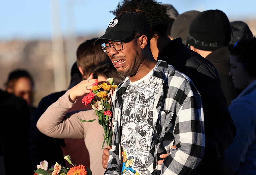 Jey Swisher reacts Nov. 20 after a mass shooting at Club Q, a LGBTQ nightclub. (CNS/Reuters/Kevin Mohatt)