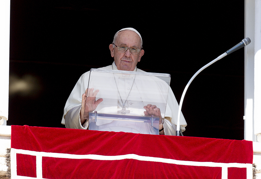 Pope Francis leads the Angelus from the window of his studio overlooking St. Peter's Square Oct. 2 at the Vatican. The pope begged Russian President Vladimir Putin to stop the war in Ukraine and condemned Russia's annexation of four Ukrainian regions. He also called upon Ukrainian President Volodymyr Zelenskyy to be open to serious peace proposals. (CNS/Vatican Media)