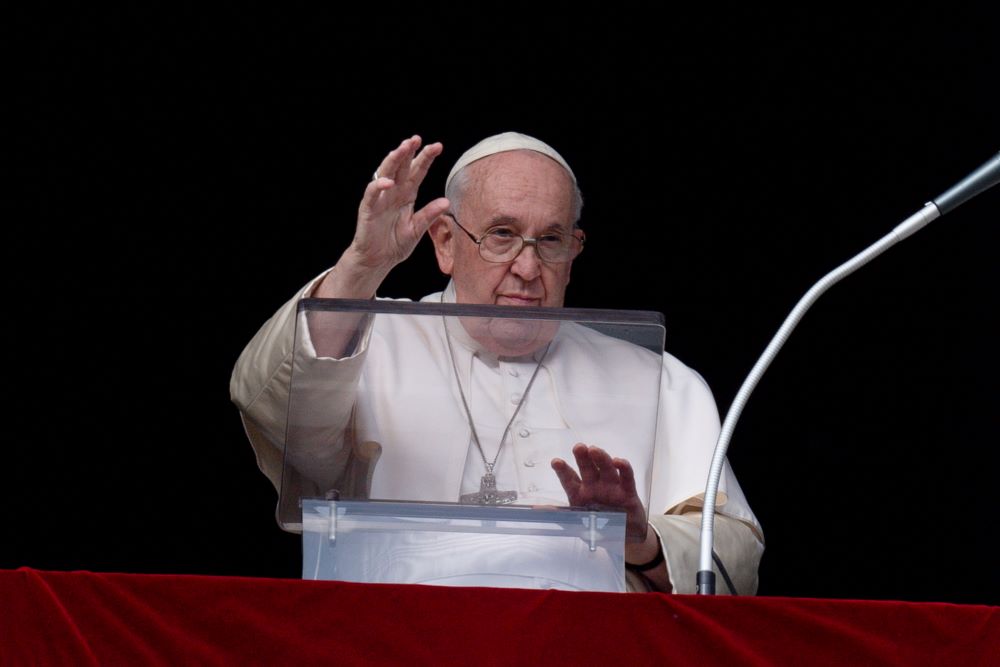 Pope Francis waves to visitors and pilgrims gathered in St. Peter's Square at the Vatican for the recitation of the Angelus prayer Dec. 26, the feast of St. Stephen. (CNS/Vatican Media)