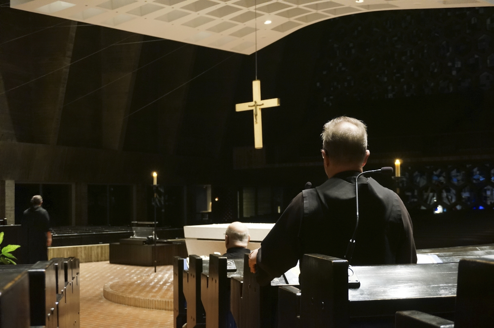 Benedictine monks gather for evening prayers in the mid-20th century church next to their abbey on the campus of St. John's University in Collegeville, Minnesota, on Nov. 8. (AP/Giovanna Dell'Orto)