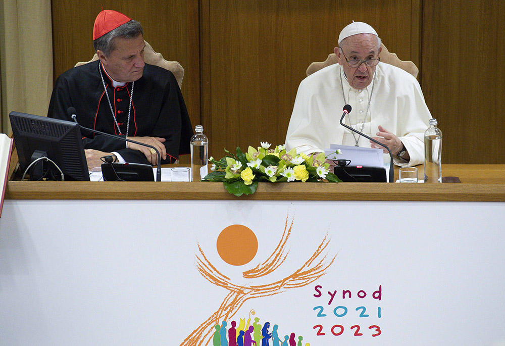 Pope Francis speaks as Maltese Cardinal Mario Grech, secretary-general of the Synod of Bishops, looks on during a meeting with representatives of bishops' conferences from around the world at the Vatican in this Oct. 9, 2021, file photo. (CNS/Paul Haring) Pope Francis speaks as Maltese Cardinal Mario Grech, secretary-general of the Synod of Bishops, looks on during a meeting with representatives of bishops' conferences from around the world at the Vatican in this Oct. 9, 2021, file photo. (CNS/Paul Haring)
