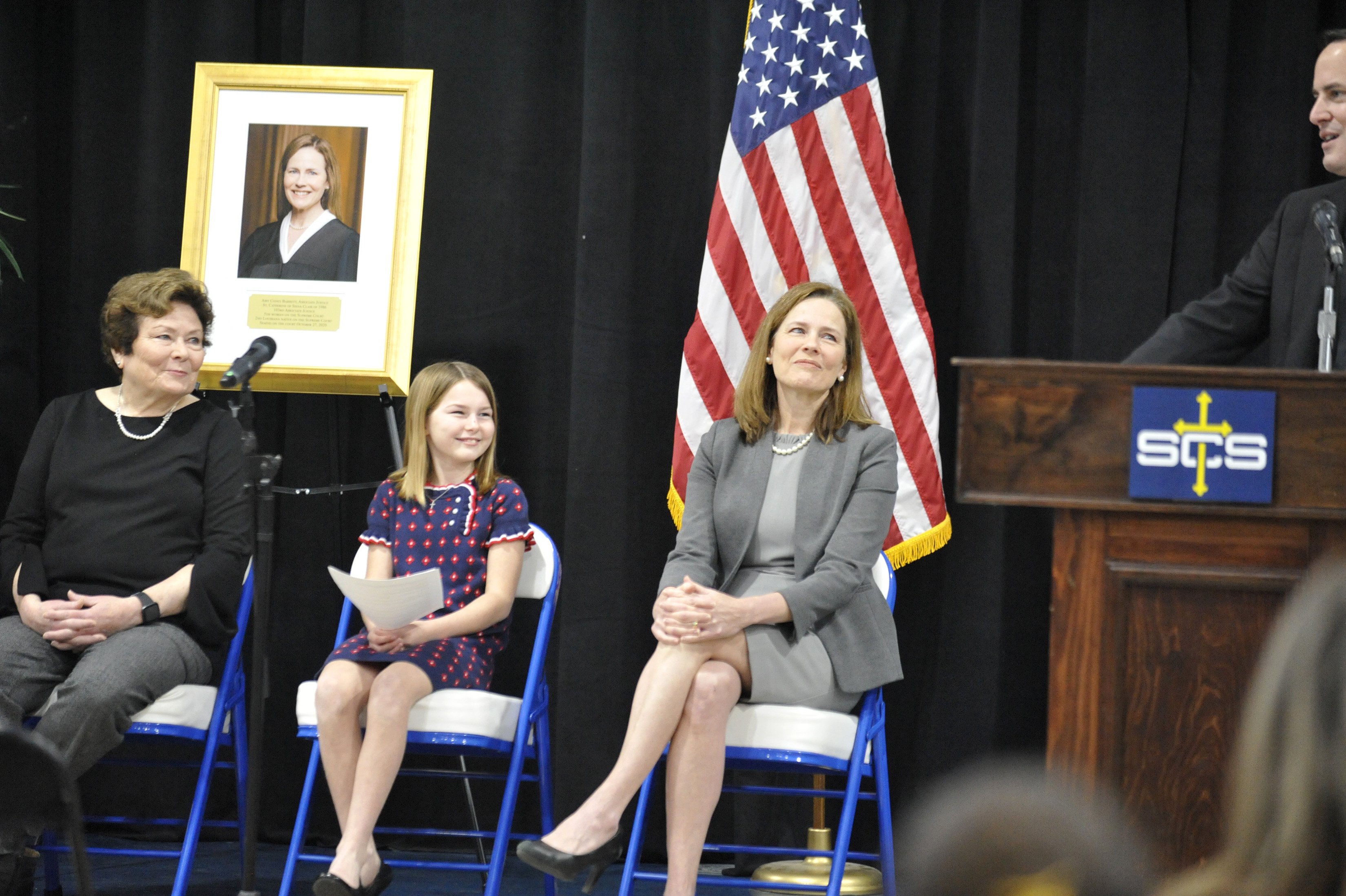 Father Tim Hedrick, pastor of St. Catherine of Siena Parish in Metairie, La., welcomes U.S. Supreme Court Associate Justice Amy Coney Barrett after her speech to the Catholic school Jan. 24, 2022. (CNS photo/Peter Finney Jr., Clarion Herald New Orleans)