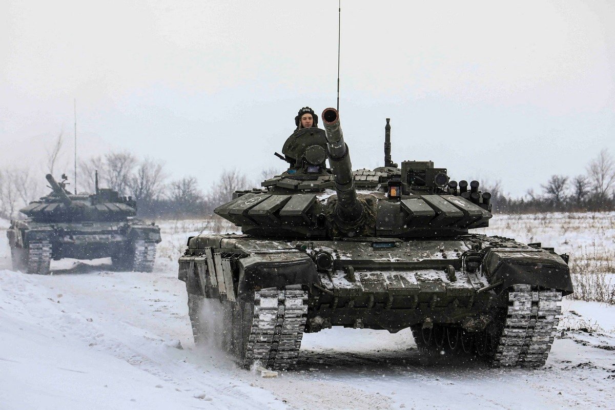 Members of the Russian armed forces drive tanks during military exercises in the Leningrad region of Russia in this handout photo released Feb. 14, 2022. (CNS photo/Russian Defense Ministry, Handout via Reuters)