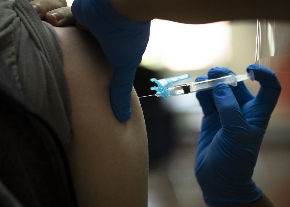 A health care worker at Catholic Charities in the Brookland neighborhood of Washington, D.C., administers the Johnson & Johnson COVID-19 vaccine May 18, 2021. (CNS/Tyler Orsburn)