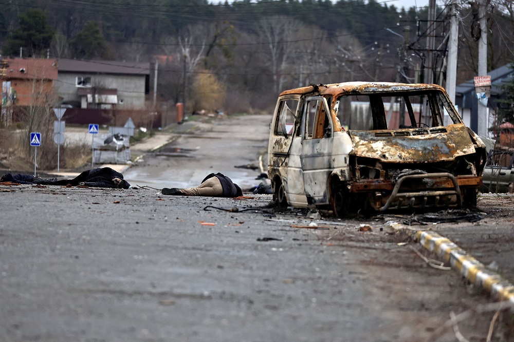 Bodies of civilians who, according to residents, were killed by Russian soldiers, lie on the street in Bucha, Ukraine, April 2, 2022.