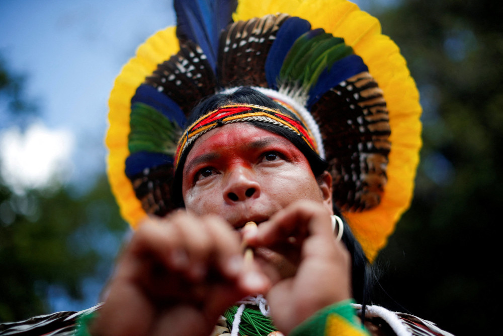 Ubiranan Pataxo plays music during the Acampamento Terra Livre 2022-ATL (Free Land Camp) protest in Brasília, Brazil, April 4. (CNS/Reuters/Adriano Machado)