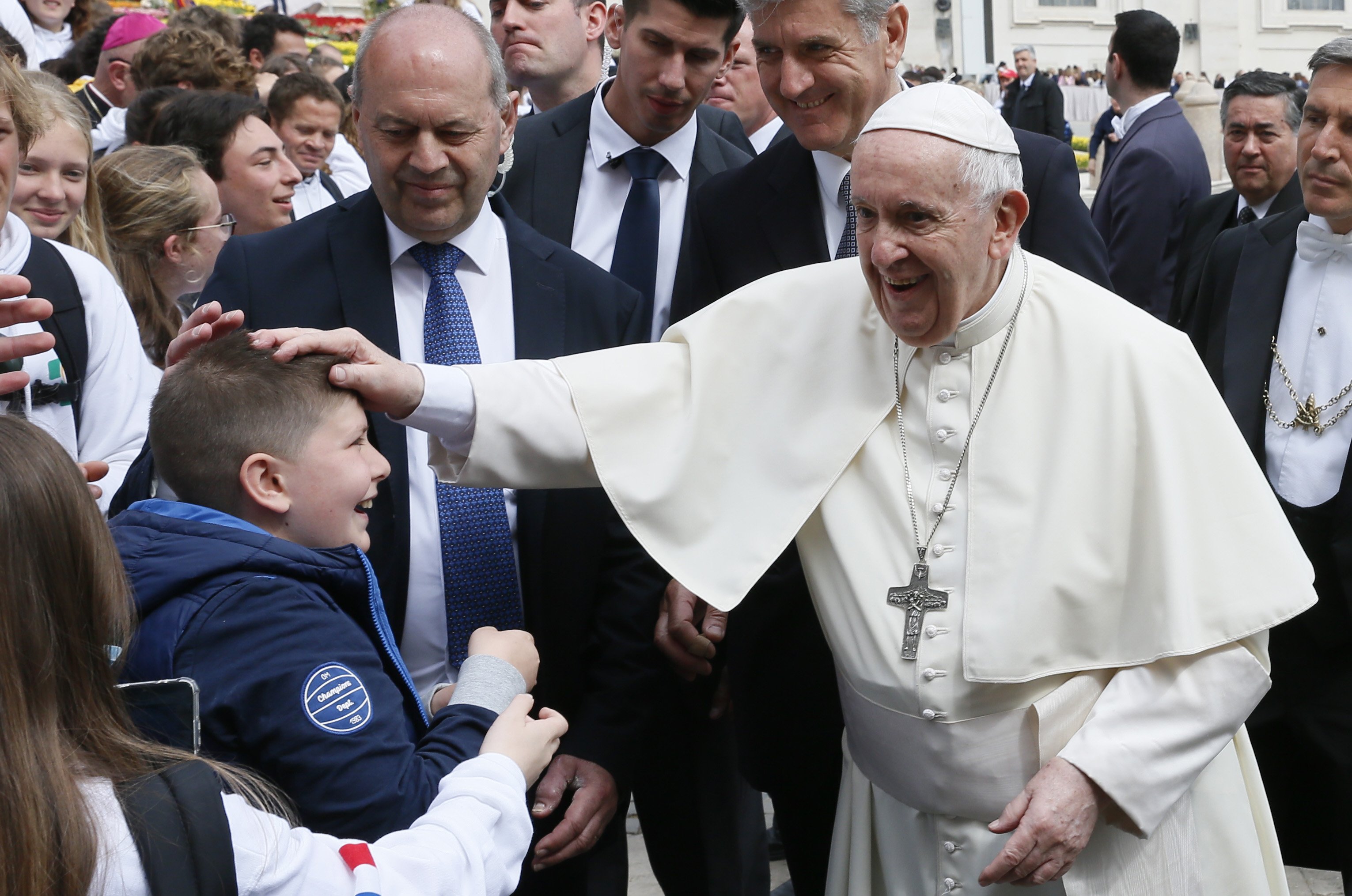 Pope Francis greets a boy during his general audience in St. Peter's Square at the Vatican April 20, 2022. (CNS photo/Paul Haring)