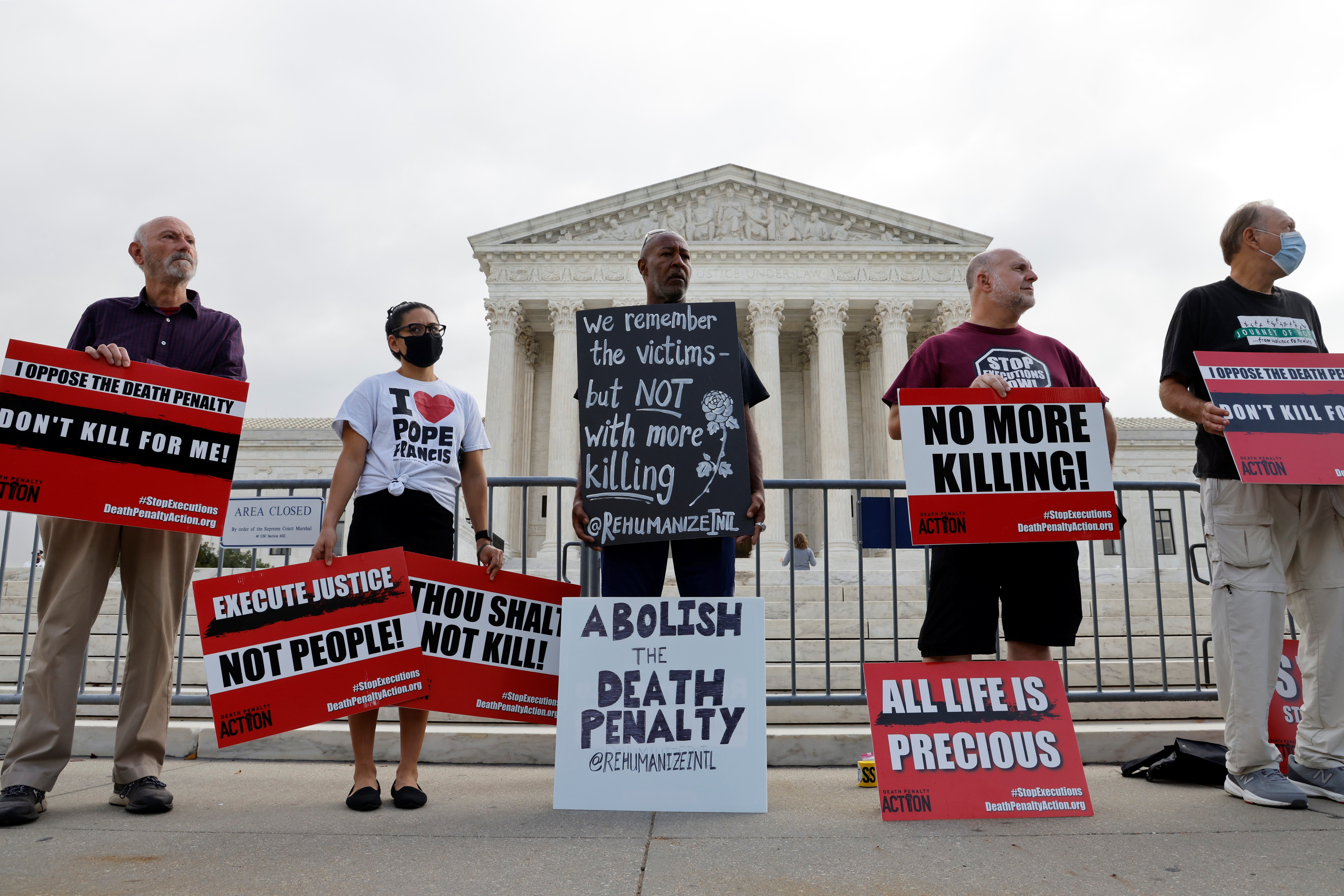 Death penalty protesters are seen outside the U.S. Supreme Court building in Washington Oct. 13, 2021. (CNS photo/Jonathan Ernst, Reuters)