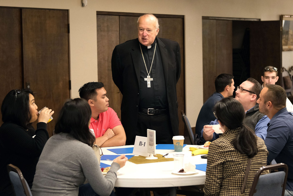 Bishop Robert McElroy of San Diego chats with participants in the closing session of the San Diego Diocese's synod on young adults at Mission San Diego de Alcalá Nov. 9, 2019. He was among 21 new cardinals named by Pope Francis May 29. (CNS)