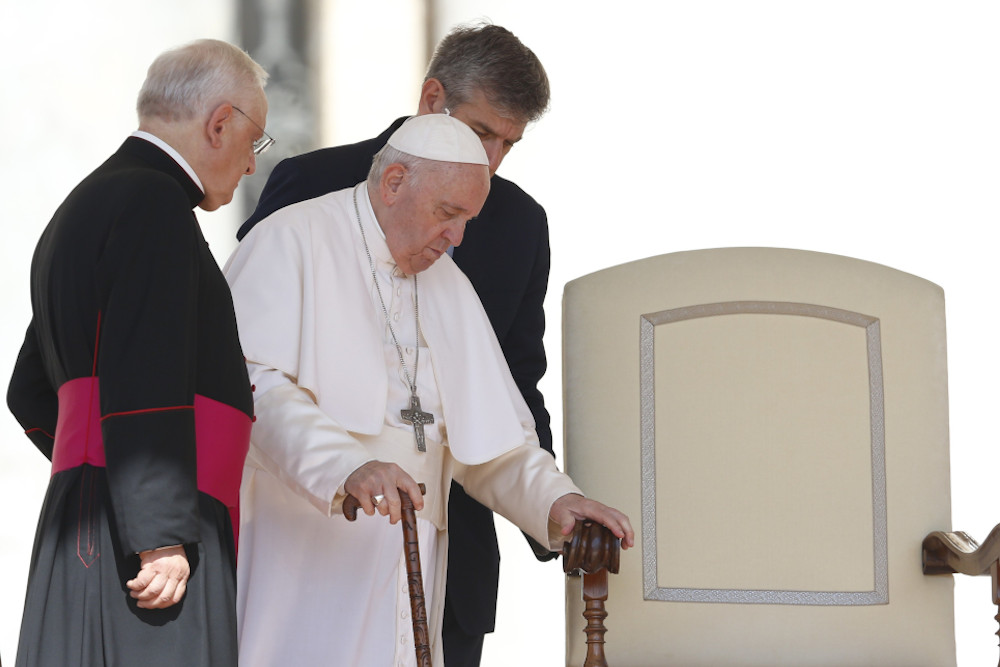 Pope Francis arrives at his chair during his general audience in St. Peter's Square at the Vatican June 8. (CNS/Paul Haring)