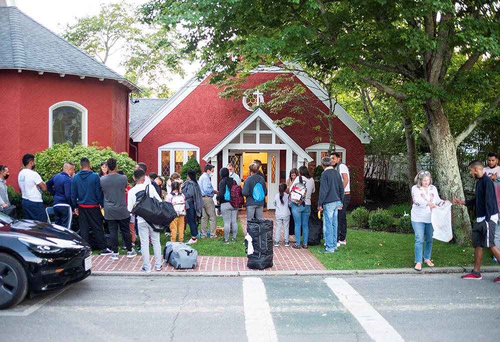Venezuelan migrants stand outside St. Andrew's Episcopal Church Sept 14 in Edgartown, Massachusetts, on Martha's Vineyard. (CNS/Vineyard Gazette via Reuters/Ray Ewing) Venezuelan migrants stand outside St. Andrew's Episcopal Church Sept 14 in Edgartown, Massachusetts, on Martha's Vineyard. (CNS/Vineyard Gazette via Reuters/Ray Ewing)