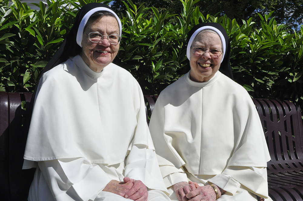 Sr. Elizabeth Anne Allen and Sr. Jean Marie Warner of the Congregation of Dominican Sisters of St. Cecilia in Nashville, Tennessee, share a joyful moment Sept. 12 as they celebrate their golden jubilee, which officially occurred July 8, and 50 years of fr