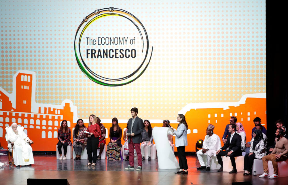 Pope Francis is welcomed to Assisi, Italy, Sept. 24, 2022, by young economists, entrepreneurs, financial advisers, scholars and scientists who have been working for two years on the Economy of Francesco project. (CNS photo/Remo Casilli, Reuters)