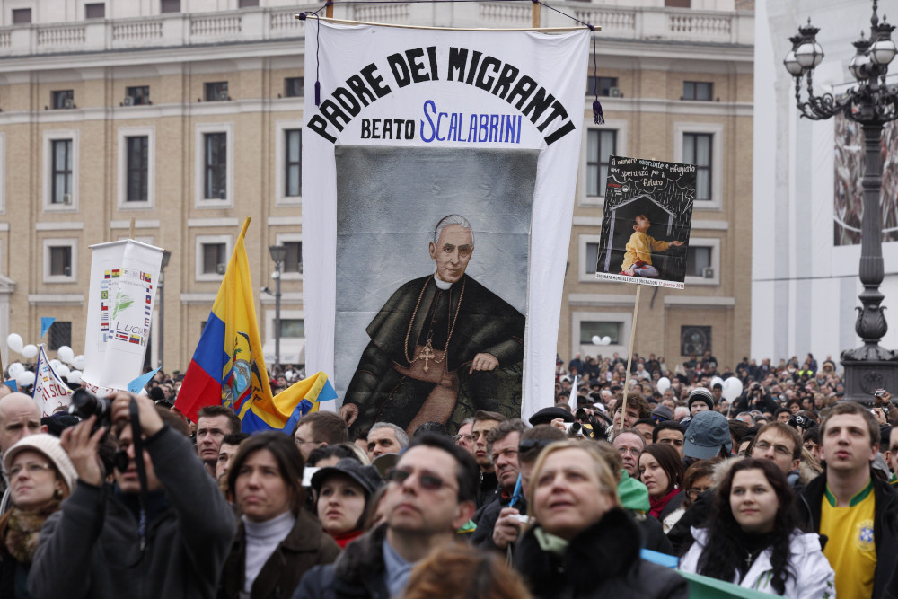 A banner honoring Blessed Giovanni Battista Scalabrini is seen as Pope Benedict XVI leads the Angelus at the Vatican in this Jan. 17, 2010, file photo. (CNS photo/Paul Haring)