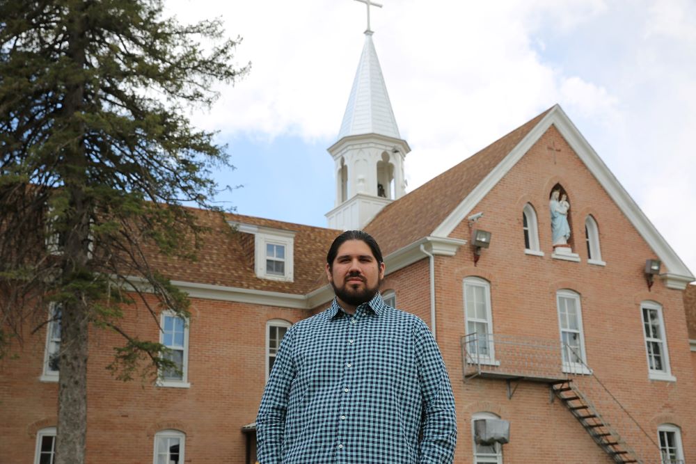 Maka Black Elk, a leader in Native American and Catholic education for truth, healing and reconciliation, is seen in front of the Red Cloud Indian School in Pine Ridge, S.D., May 5, 2021. (CNS/Marcus Fast Wolf, courtesy Red Cloud Indian School)