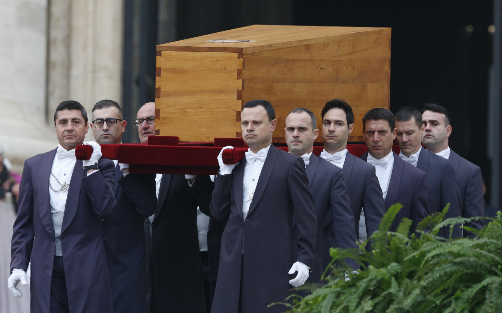 Pallbearers carry the casket of Pope Benedict XVI in St. Peter's Square at the Vatican before Pope Francis' celebration of his funeral Mass Jan. 5, 2023. (CNS photo/Paul Haring)