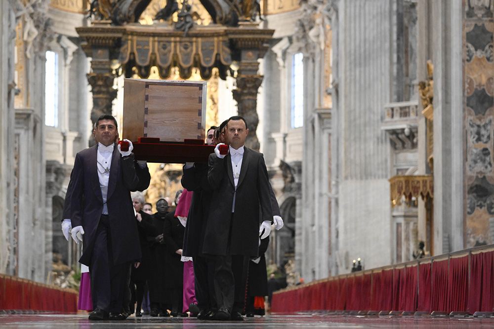 Pallbearers carry the casket of Pope Benedict XVI in St. Peter's Basilica during a procession to St. Peter's Square for the funeral of the late pope at the Vatican Jan. 5. (CNS/Vatican Media)