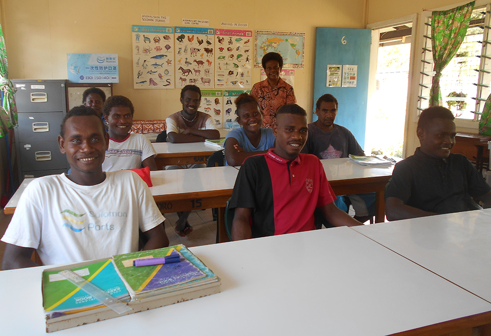 Sr. Sonia Tulili, standing in back, with her Year 3 and Year 4 literacy and numeracy class in October 2022 at San Isidro Care Centre. In the academic classes — sign language, mathematics, English, health, and Christian education — the students are mixed according to their capacity. (Courtesy of Maria Fe Rollo)