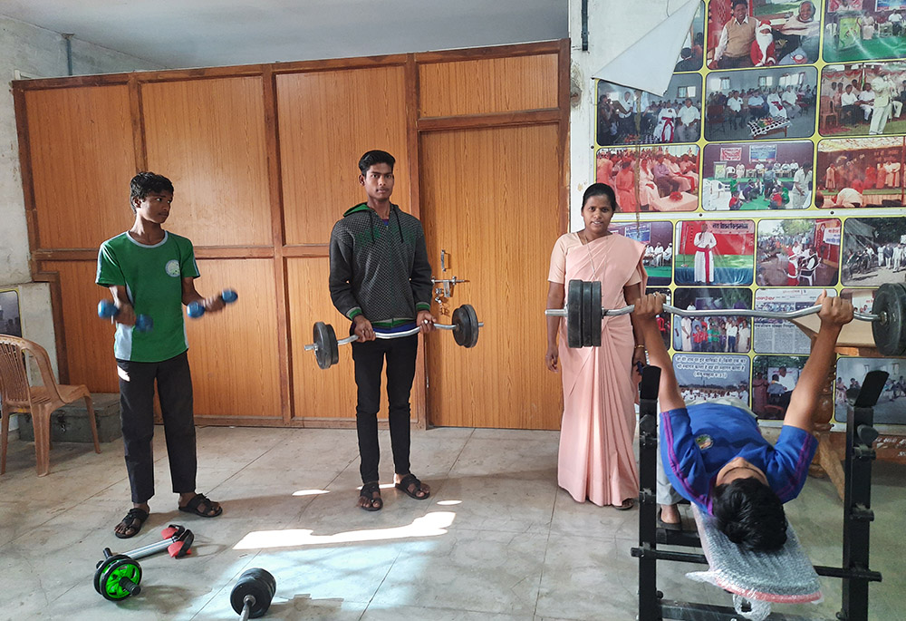 Sr. Indu Toppo of the Daughters of Our Lady of the Garden monitors children at a gym inside Navjeevan. (GSR photo/Saji Thomas)