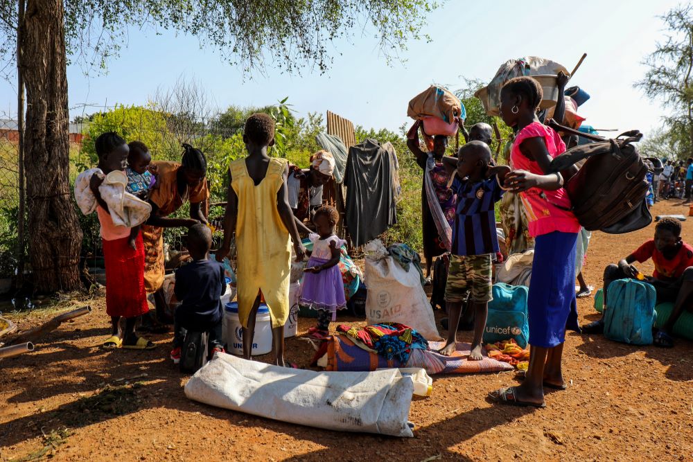 A group of internally displaced people arrive by boat at Malakal riverside seeking safety at the Malakal Protection of Civilians (PoC) site in Upper Nile State, South Sudan, Dec. 3, 2022. (CNS/UNHCR/Charlotte Hallqvist)