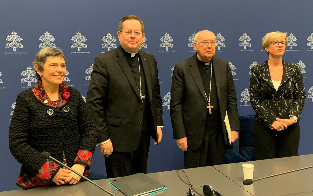 Speakers at a Vatican news conference pose for a photo Feb. 14 after talking to journalists about the Dicastery for Laity, the Family and Life's international gathering to promote closer cooperation and a sense of co-responsibility between clergy and laity. From the left: Andrea Poretti, a leader of the Sant'Egidio Community in Argentina; Cardinal Gérald Lacroix of Quebec; Cardinal Kevin J. Farrell, dicastery prefect; and Linda Ghisoni, dicastery undersecretary. (CNS/Cindy Wooden)