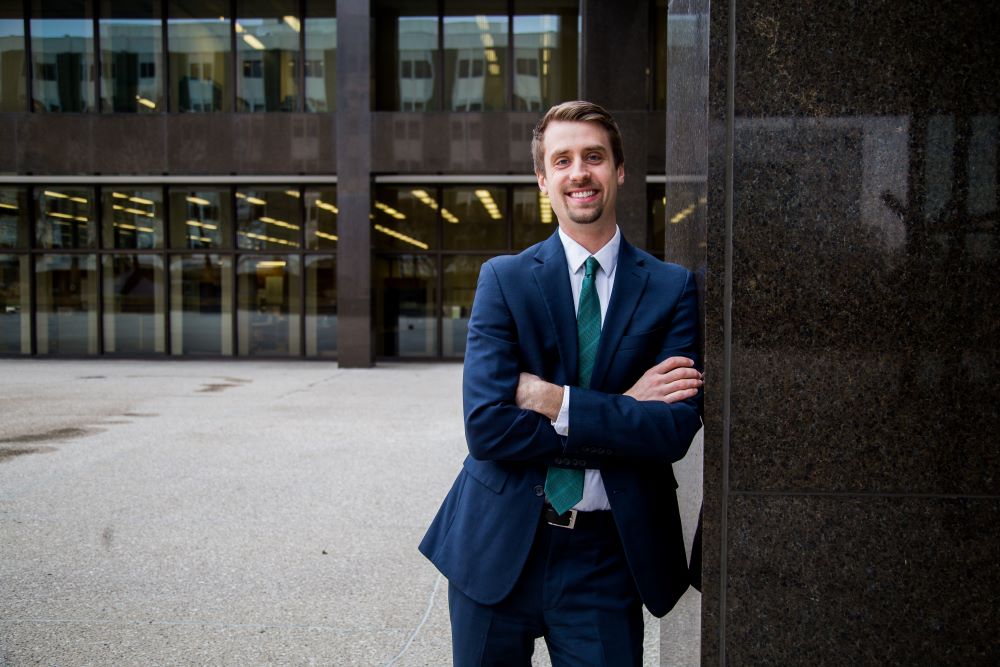 Kyle Meyaard-Schaap leans against a building