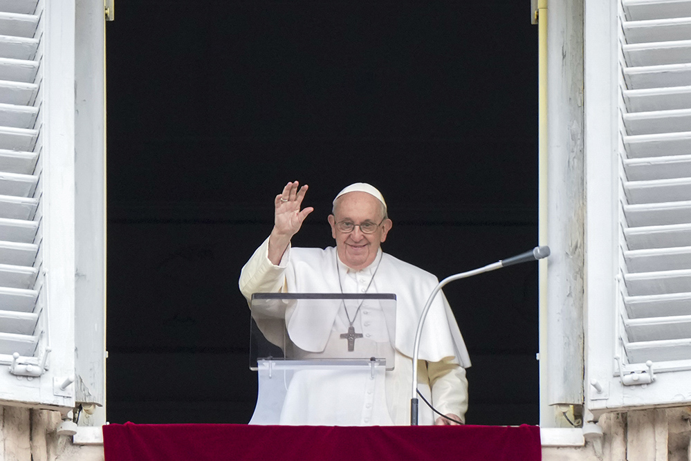 Pope Francis delivers his blessing as he recites the Angelus noon prayer from the window of his studio overlooking St. Peter's Square at the Vatican Feb. 26. (AP/Andrew Medichini)