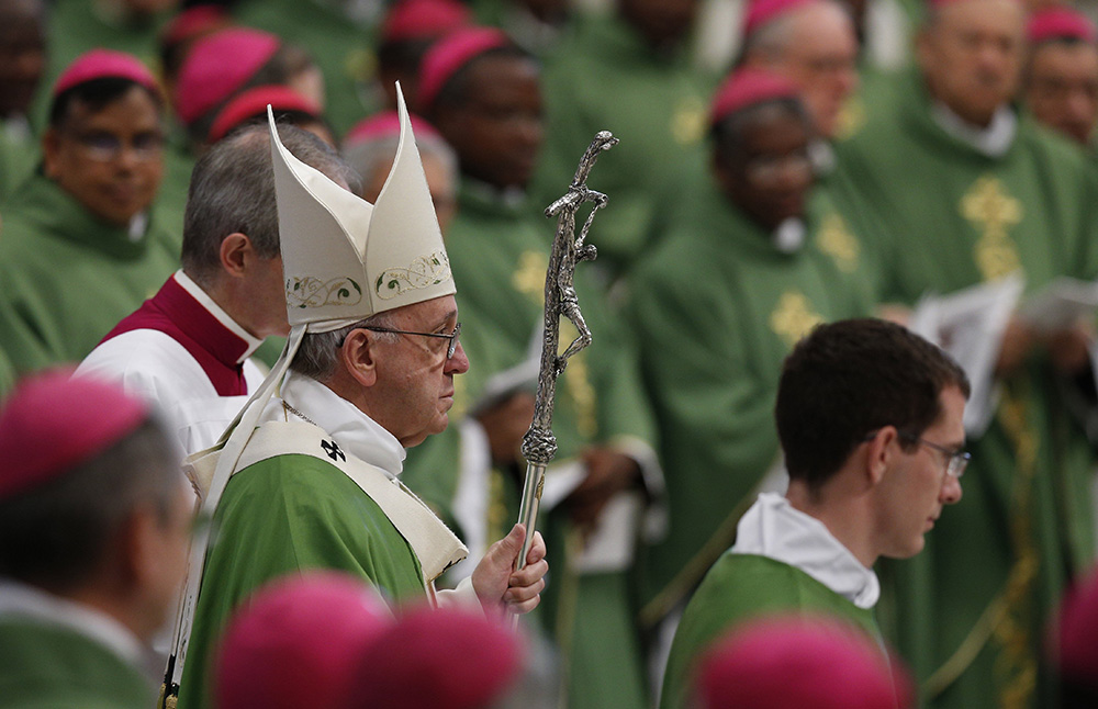 Pope Francis arrives to celebrate the closing Mass of the Synod of Bishops on the family in St. Peter's Basilica at the Vatican Oct. 25, 2015. (CNS/Paul Haring)