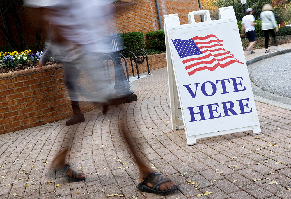 People at the Smyrna Community Center in Smyrna, Georgia, visit an early voting location Nov. 3, 2022, during midterm elections. During their 2022 fall general assembly, the U.S. bishops voted to keep their quadrennial document "Forming Consciences for Faithful Citizenship" and supplement it with inserts, social media components and an introductory note. (CNS/Reuters/Jonathan Ernst)