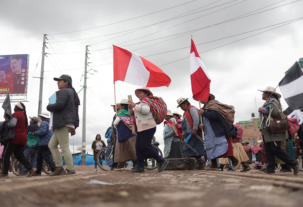 Anti-government demonstrators protest against Peruvian President Dina Boluarte in Juliaca Feb. 9, amid the worst wave of protests in at least two decades in the Andean country. (OSV News/Reuters/Pilar Olivares)