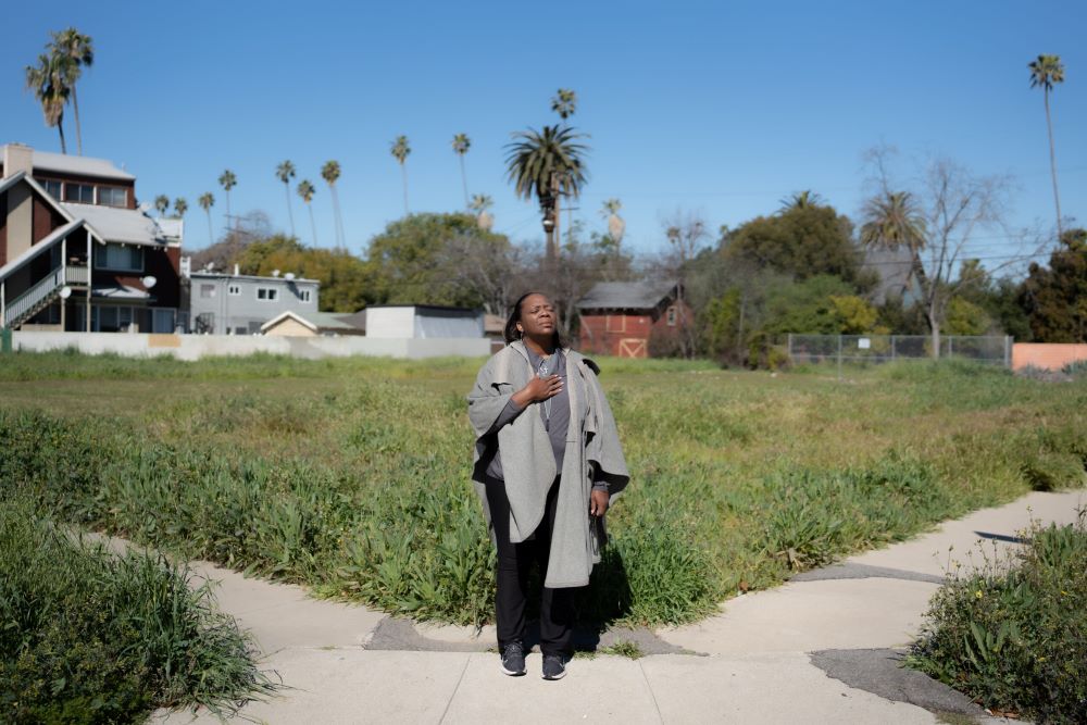 The Rev. Helena Titus stands on the corner of the street she grew up on. (Capitol & Main/Jeremy Lindenfeld)