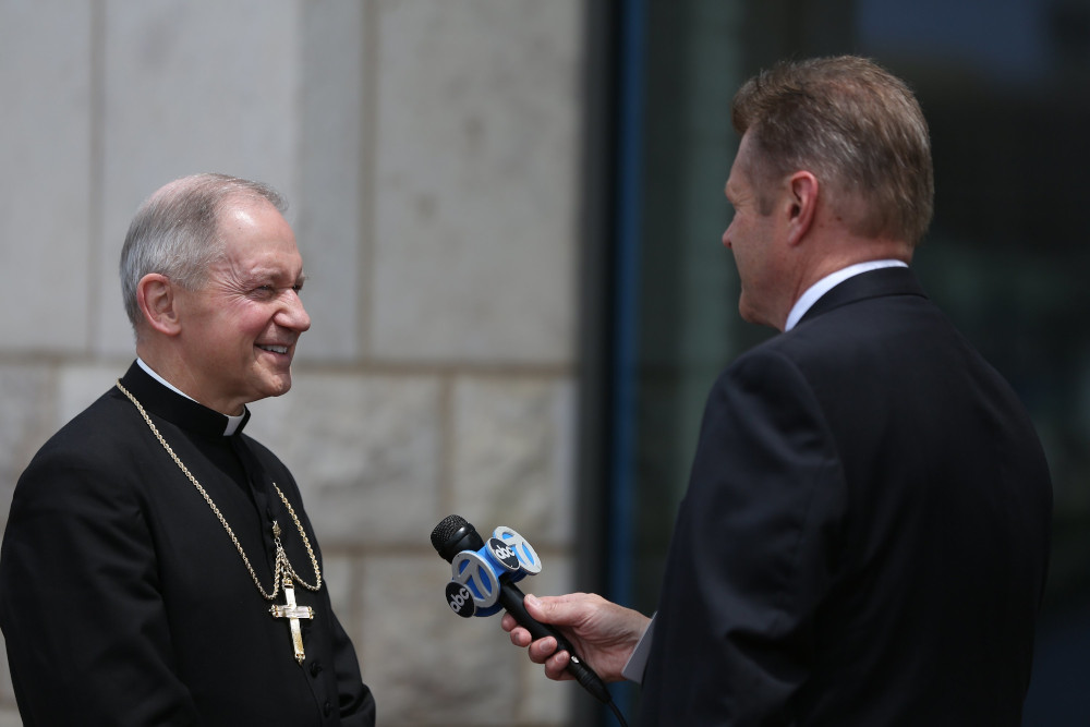 A reporter with ABC News interviews Bishop Thomas Paprocki of Springfield, Illinois, outside a Baltimore hotel during the spring general assembly of the U.S. Conference of Catholic Bishops June 12, 2019. (OSV News/CNS file/Bob Roller)