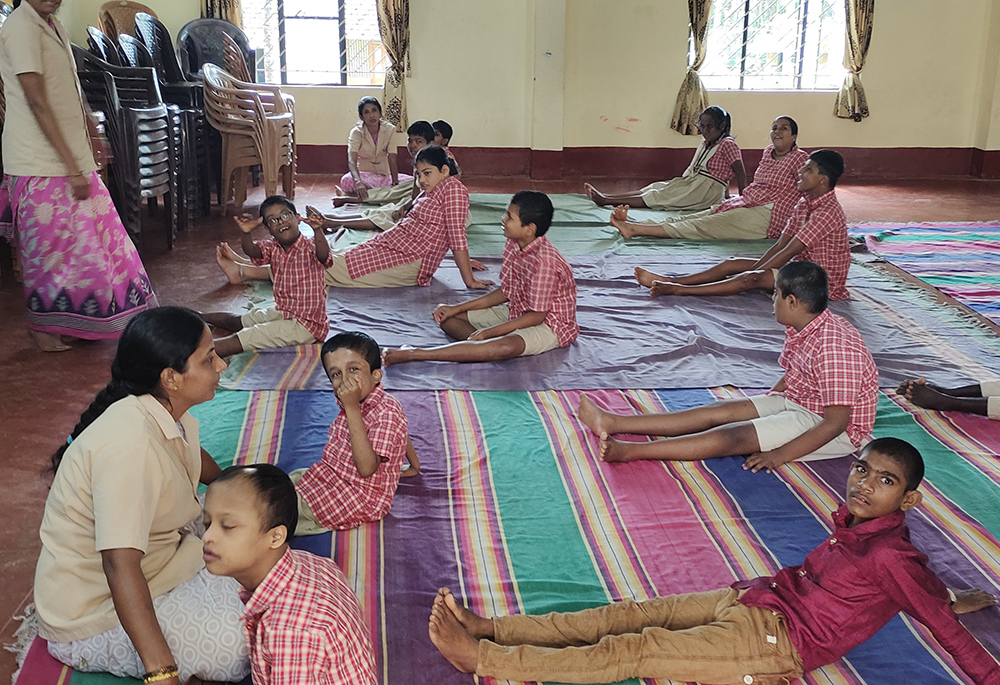 Children practice yoga at Manasa Rehabilitation and Training Centre, a laity-initiated school for children with intellectual disabilities in Pamboor, near Udupi, Karnataka state in India. (Thomas Scaria)