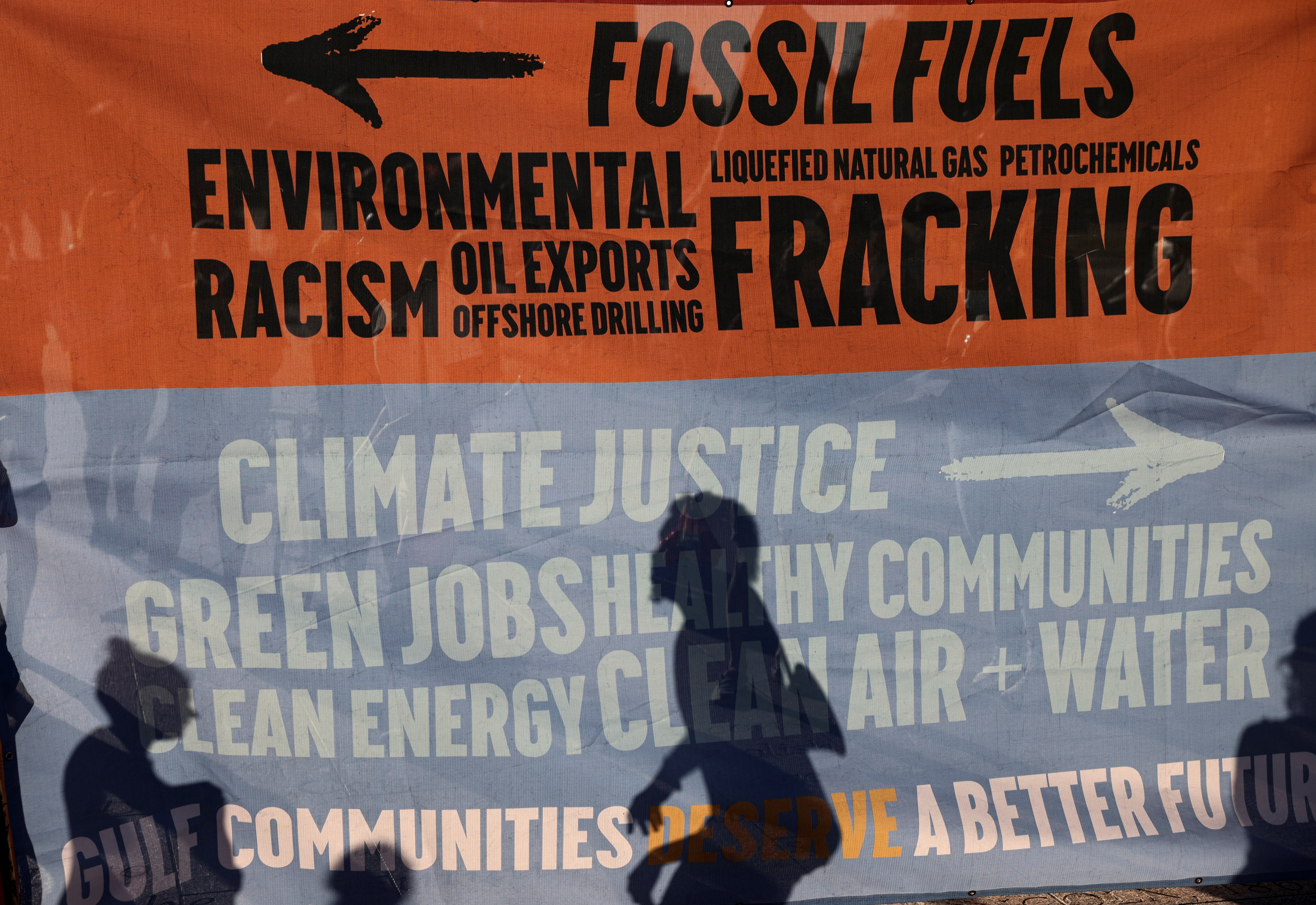 Environmental activists protest outside the White House in Washington June 30, 2021, to demand U.S. President Joe Biden stop fossil fuel projects and put climate justice at the heart of his infrastructure plans. (CNS/Reuters/Evelyn Hockstein) 