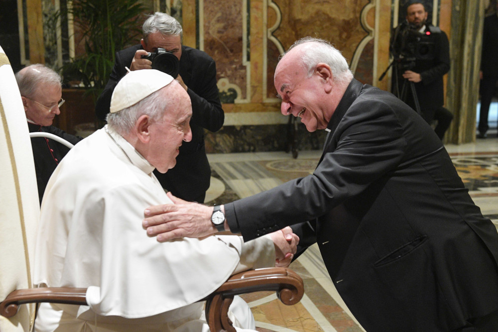 Archbishop Vincenzo Paglia, chancellor of the Pontifical John Paul II Theological Institute for the Sciences of Marriage and Family, greets Pope Francis Oct. 24, 2022, during an audience with staff and students of the institute in the Vatican's Clementine Hall. (CNS photo/Vatican Media)