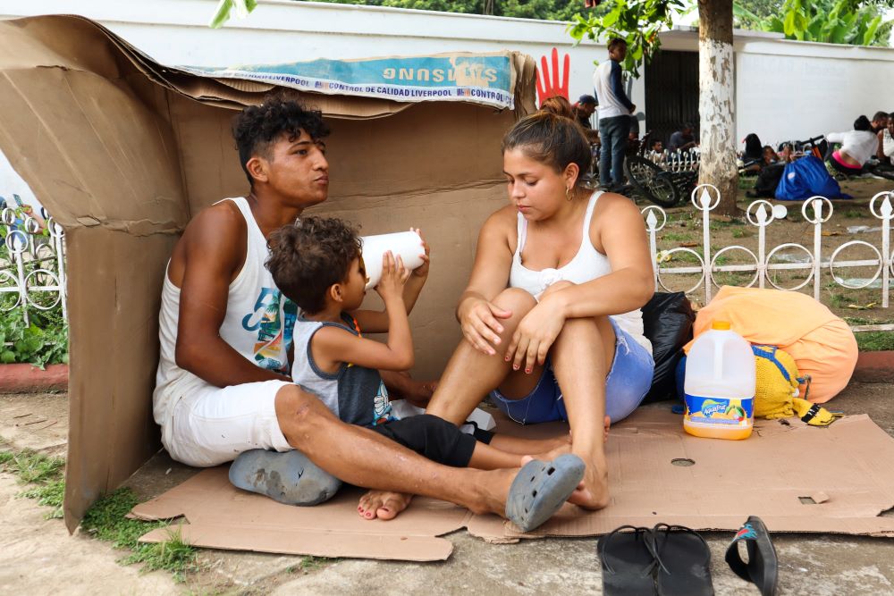 A migrant family in Huehuetán, Mexico, rests at a park with other caravan migrants heading to the U.S. border Nov. 18, 2021. (CNS/Reuters/Jose Torres)