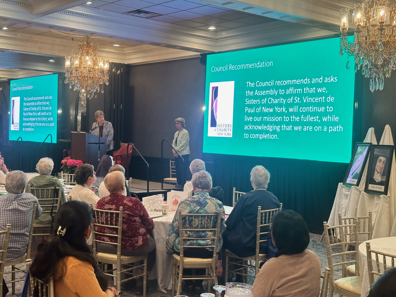 Sr. Donna Dodge, president of the Sisters of Charity of New York, reads the executive council's recommendation on the congregation's path to completion at their 2023 general assembly. (Courtesy of the Sisters of Charity of New York)