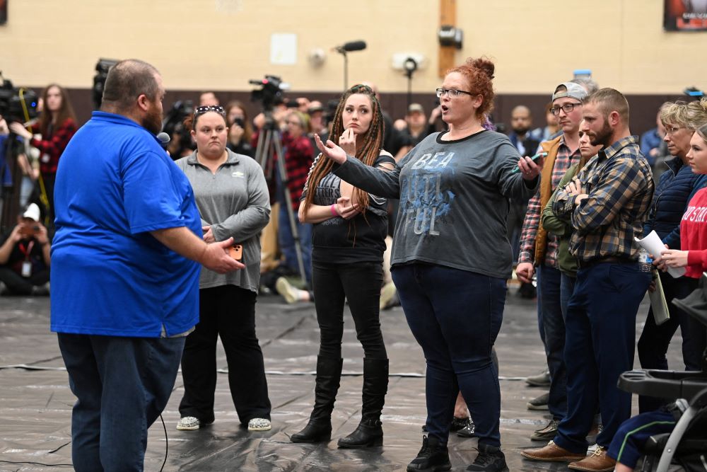 Residents of East Palestine, Ohio, and the surrounding community gather at a town hall meeting Feb. 15, 2023, to discuss safety and other environmental issues they were facing following a train derailment that spilled toxic chemicals Feb. 3. Months later residents continue to cope with the aftermath. (OSV News photo/Alan Freed, Reuters)