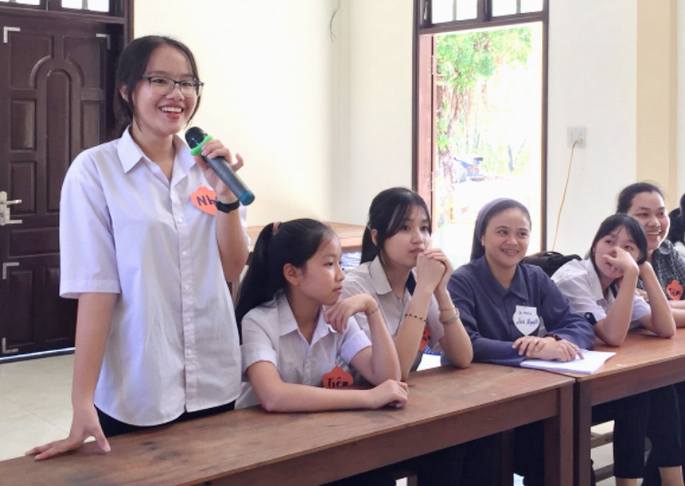 Martha Vo Thi Nhan, aged 15 from Da Han Parish, told the gathering held by Lovers of the Holy Cross sisters on Apr. 28 that she and her sister are interested in religious vocations, although their parents would be reluctant to allow them to follow the consecrated life, as they have only two children. "We are attracted to the nuns' habits that keep us in close relationship with God and help us to earn the respect of others," the 10th grader said. (Joachim Pham)