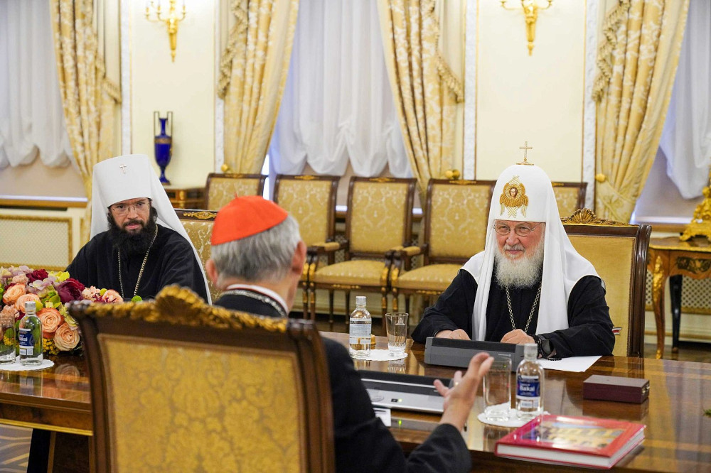 Cardinal Matteo Zuppi, on a peace mission to Moscow on Pope Francis' behalf, speaks with Russian Orthodox Patriarch Kirill of Moscow, right, and Russian Orthodox Metropolitan Anthony of Volokolamsk, head of external church relations for the Moscow Patriarchate, left, during a meeting at the patriarch's residence at the Danilov monastery in Moscow June 29, 2023. (CNS photo/Courtesy of the Russian Orthodox Church, Department for External Church Relations)