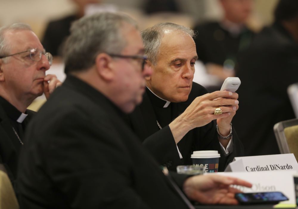 Cardinal Daniel DiNardo of Galveston-Houston prepares to vote June 16 during the U.S. Conference of Catholic Bishops' spring plenary assembly in Orlando, Fla. (OSV News/Bob Roller)