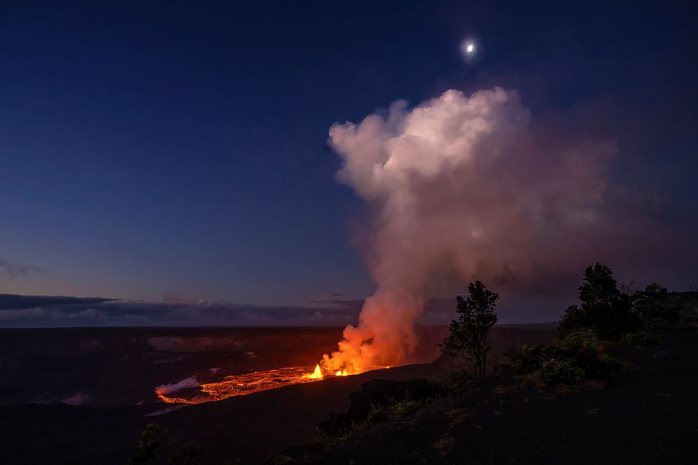 In this photo provided by the National Park Service lava spews from the Kilauea volcano in Hawaii, Wednesday, June 7, 2023.