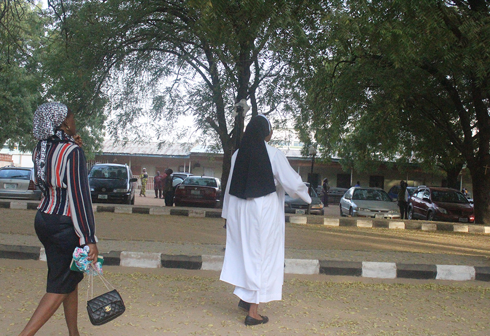 Sr. Justina Nnajiofor walks towards the car park after Mass March 5. (Patrick Egwu)