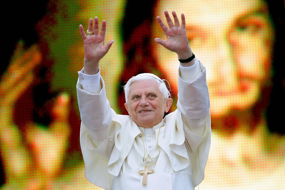 Pope Benedict XVI greets an estimated 600,000 youths while standing in front of a huge portrait of Christ in Krakow, Poland, May 27, 2006. (CNS/OSV News/Reuters/Max Rossi)