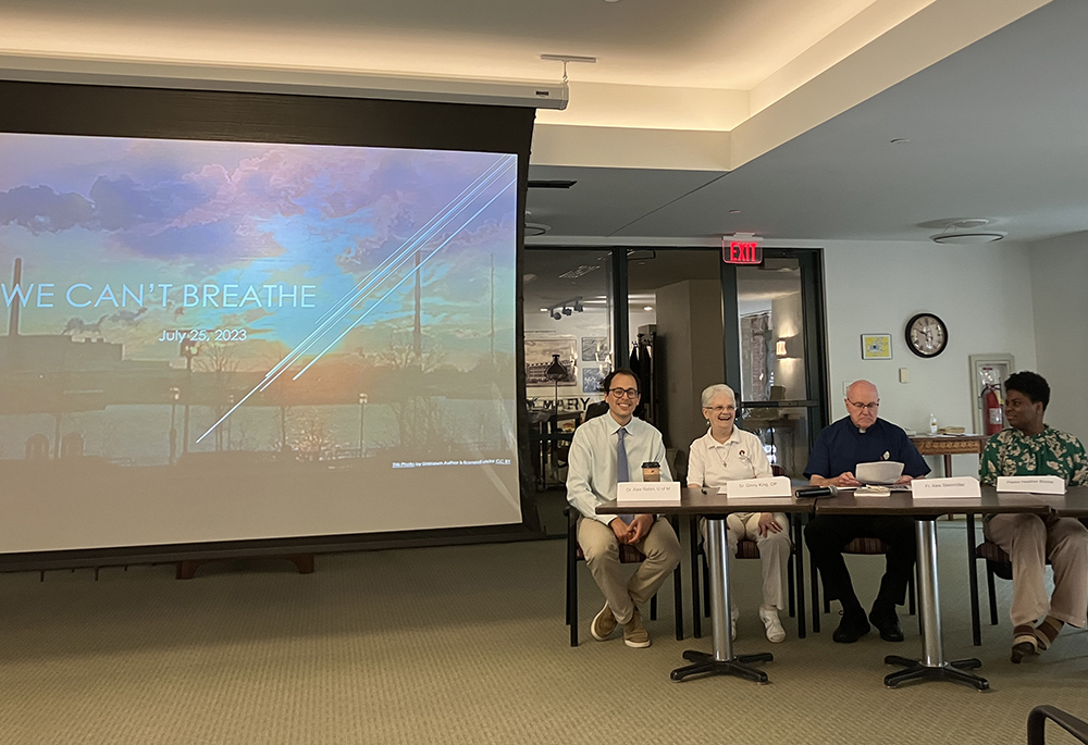 "We Can't Breathe" panelists address about 45 attendees at the Sisters, Servants of the Immaculate Heart of Mary motherhouse, July 25 in Monroe, Michigan. Pictured, left to right, are Alexander Rabin, Adrian Dominican Sr. Virginia (Ginny) King, Passionist Fr. Alex Steinmiller and Heather Boone, pastor of Oaks of Righteousness Christian Church. (Amy Ketner)