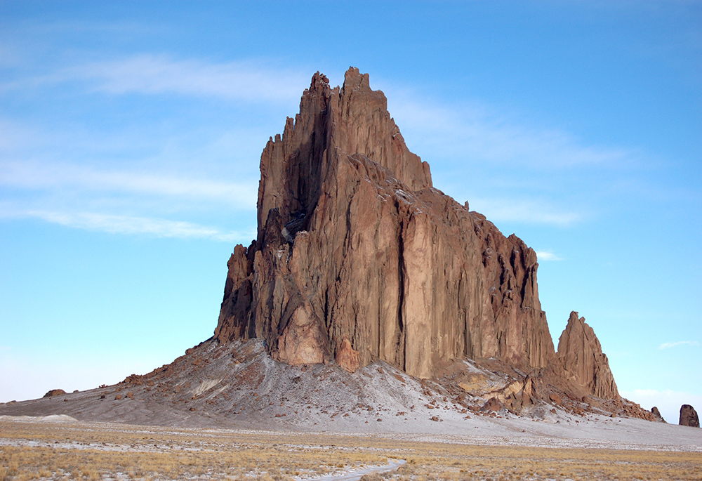 A photograph of Ship Rock, a geological formation, in Navajo Nation, New Mexico; in Navajo, it is called tsé bida'hi, "rock with wings." (Wikimedia Commons/Bowie Snodgrass, CC BY 2.0)