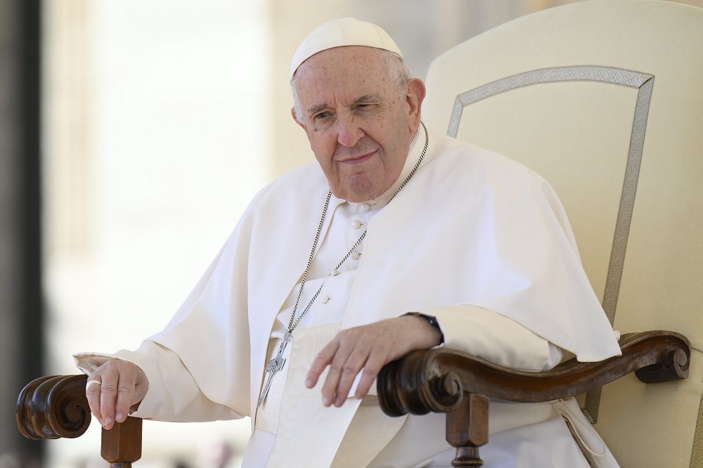 Pope Francis pauses as he speaks to more than 60,000 members of the Communion and Liberation movement in St. Peter's Square at the Vatican Oct. 15, 2022. The audience was part of the movement's celebration of the 100th anniversary of the birth of the late Father Luigi Giussani, the movement's founder.