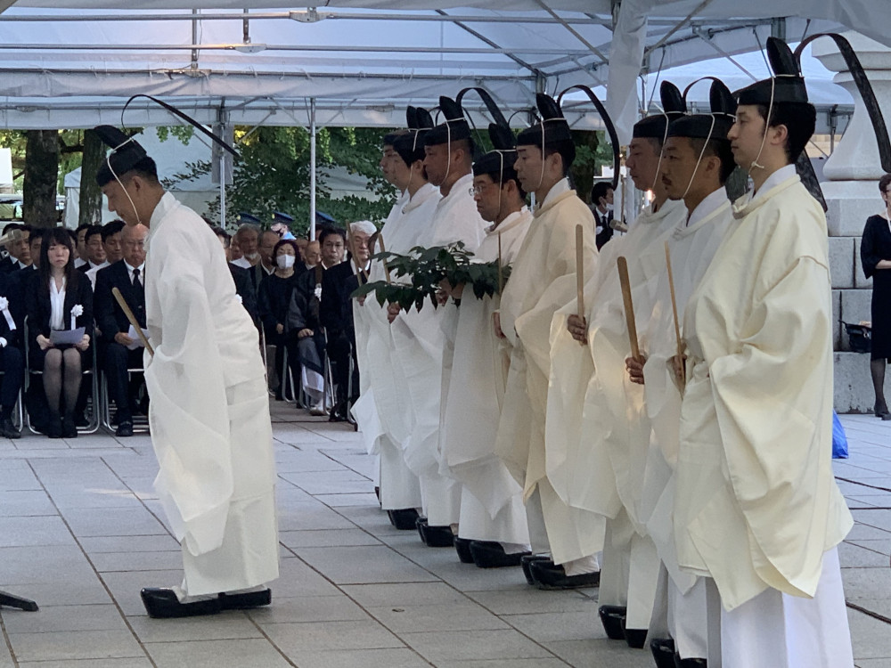 Shinto priests bow to the altar during an interfaith service at the Atomic Bomb Memorial Mound in Hiroshima, Japan, Aug. 6, 2023, to commemorate those who died in the atomic bombing of Hiroshima Aug. 6, 1945. (OSV News photo/Northwest Catholic)